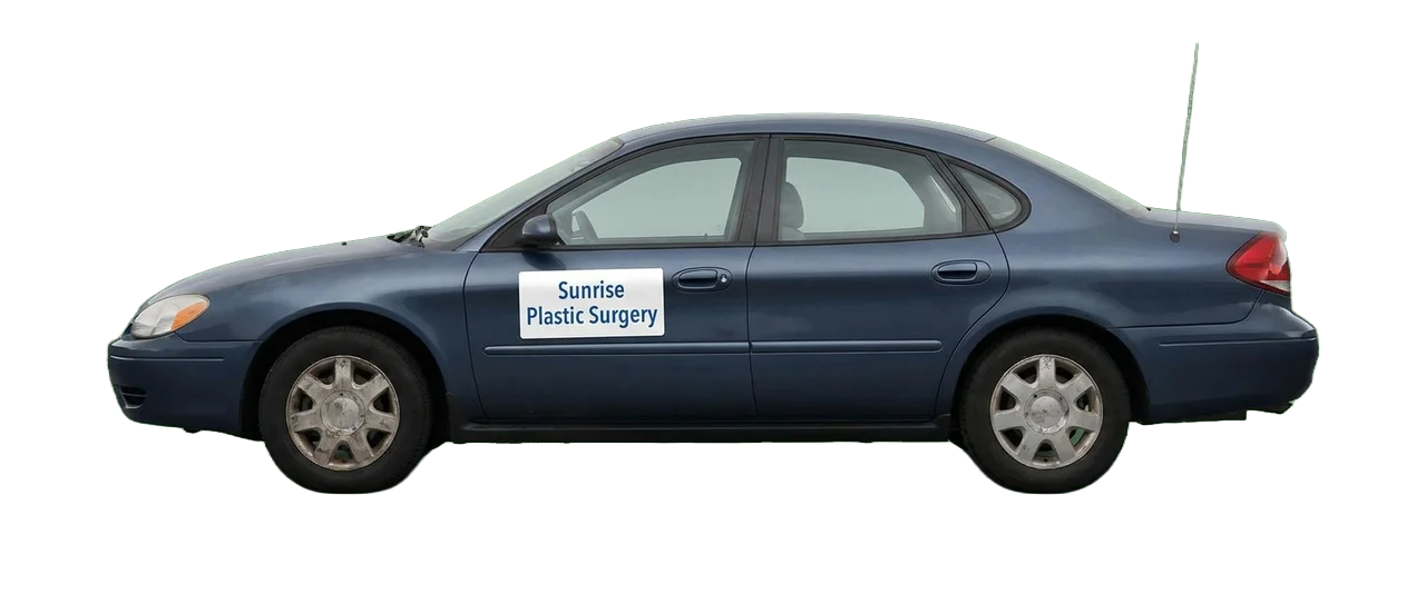An older blue sedan with a magnetic 'Sunrise Plastic Surgery' sign on the door — the visual shorthand for marketing that's fine but isn't winning anymore
